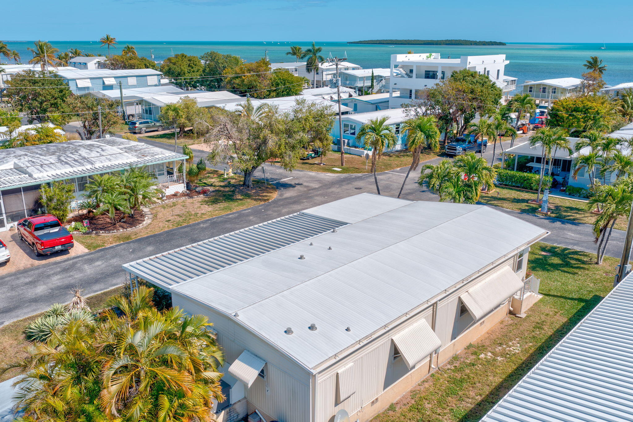 902 South Ruby Drive Key Largo, FL 33037 - Photo 15 of 44 a view of a patio with plants and table