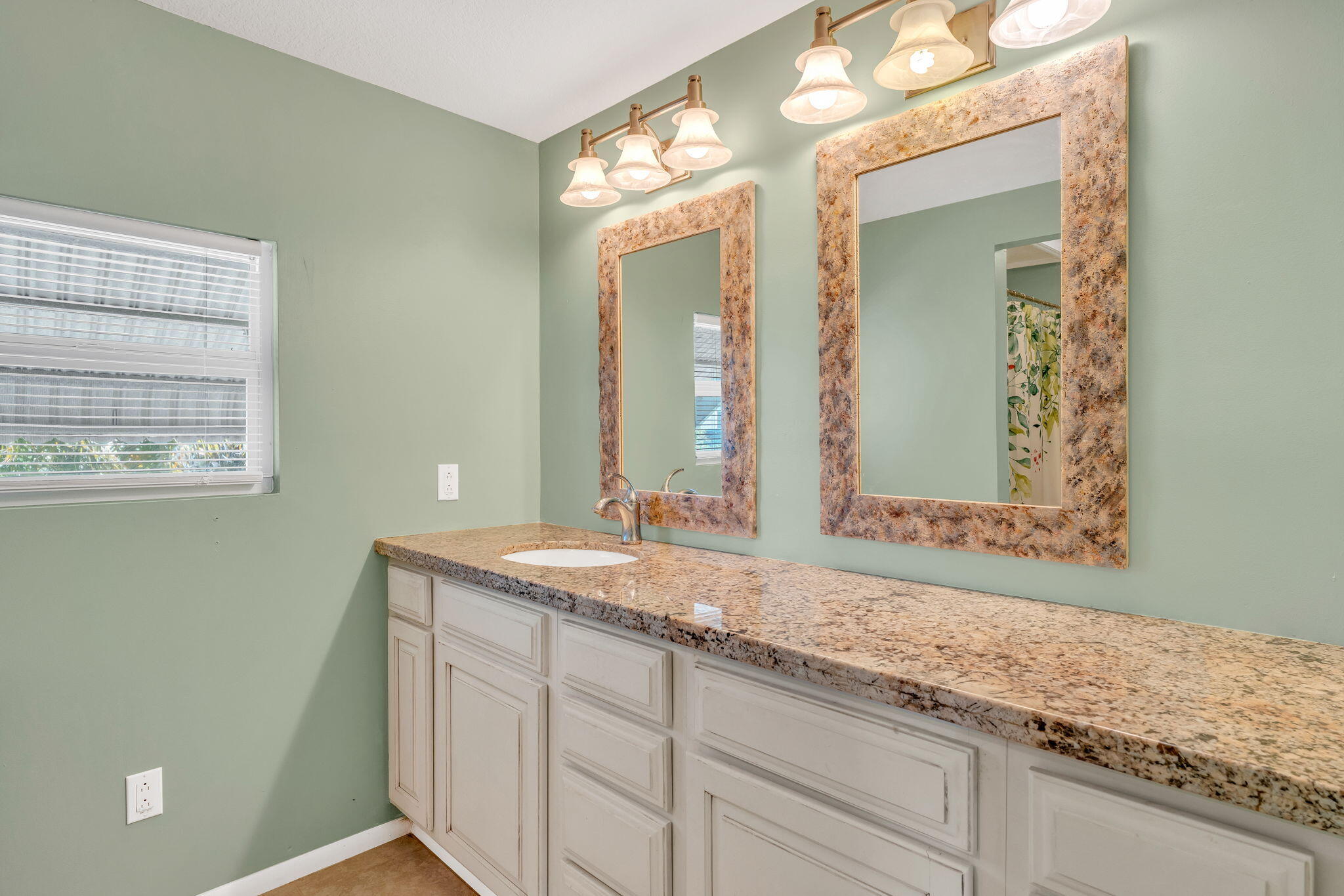 902 South Ruby Drive Key Largo, FL 33037 - Photo 24 of 44 a bathroom with a granite countertop sink and a mirror