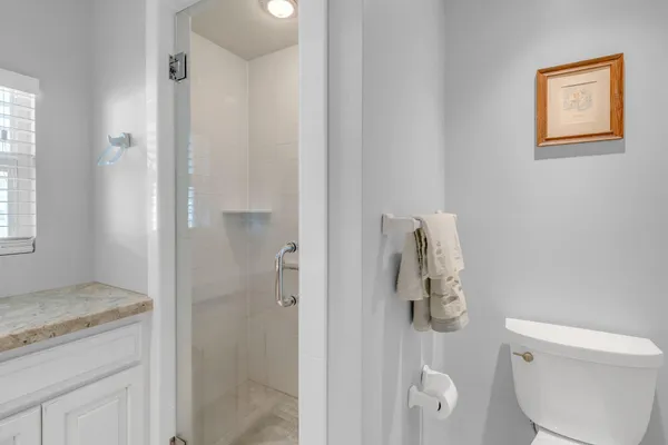 a bedroom with furniture and a rug