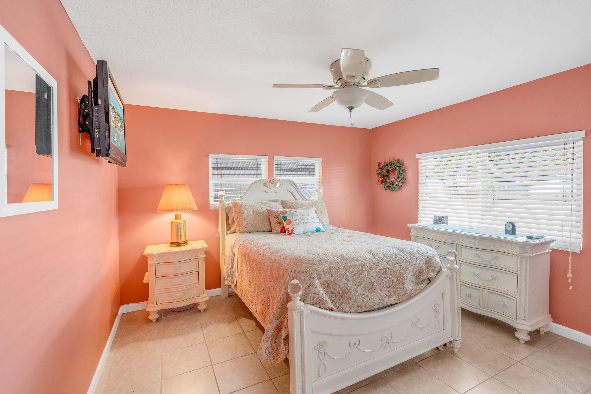 902 South Ruby Drive Key Largo, FL 33037 - Photo 29 of 44 a bedroom with a bed and a chandelier
