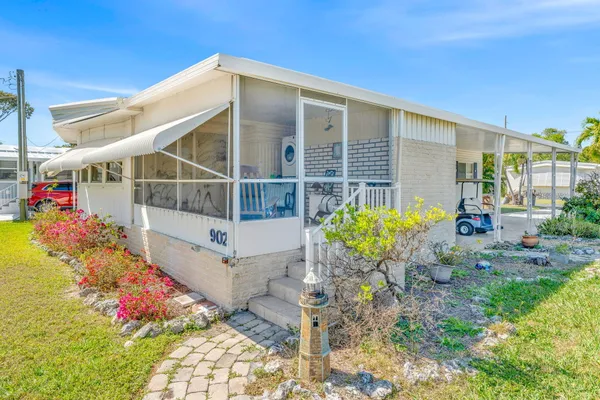 an aerial view of a house with a lake view