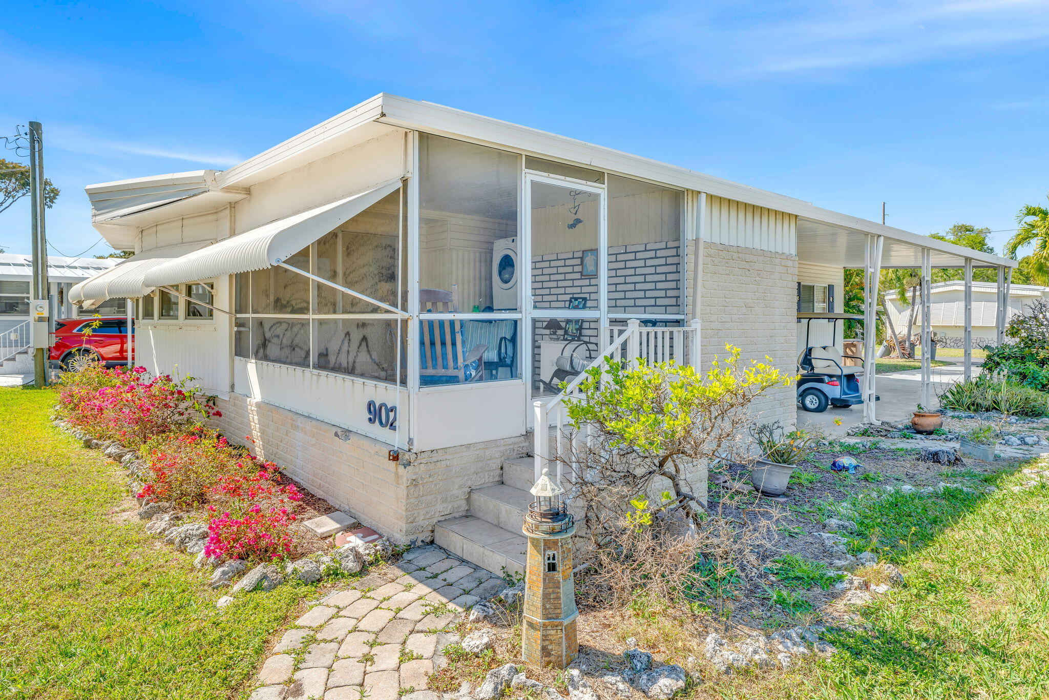 902 South Ruby Drive Key Largo, FL 33037 - Photo 6 of 44 a view of a potted flower in the yard