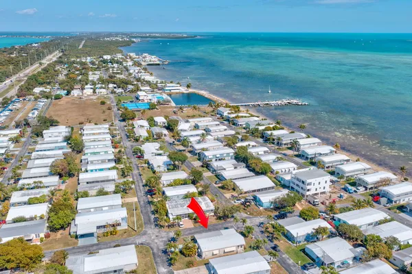 an aerial view of a houses with outdoor space