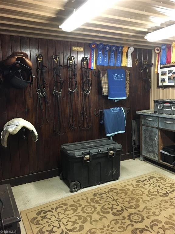 820 Pinebrook School Road Mocksville, NC 27028 - Photo 11 of 28 The tack/feed room in the barn has plenty of room to organize all your riding equipment.