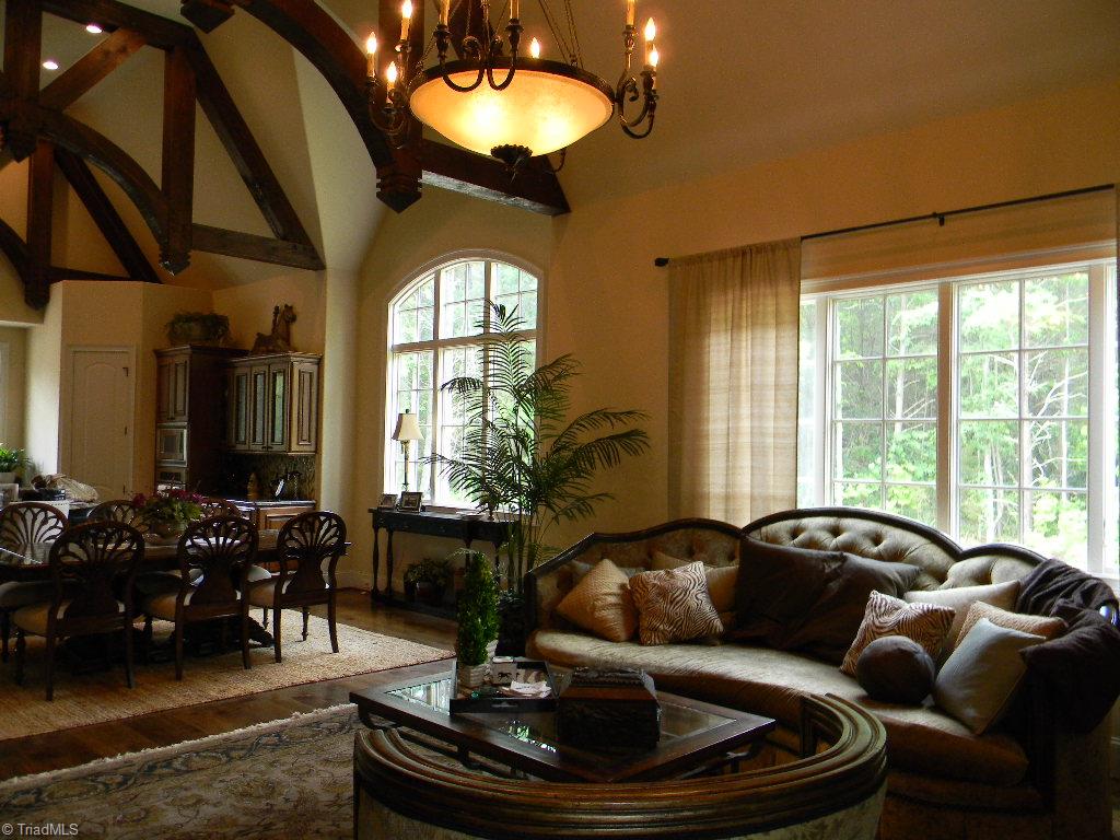 820 Pinebrook School Road Mocksville, NC 27028 - Photo 28 of 28 Inviting open floor plan with soaring ceilings, decorative timbers and walls of windows. Welcome Home!