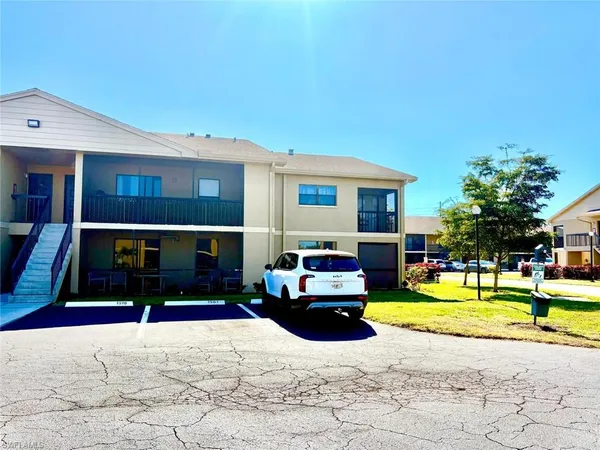 a view of a house with swimming pool and a yard