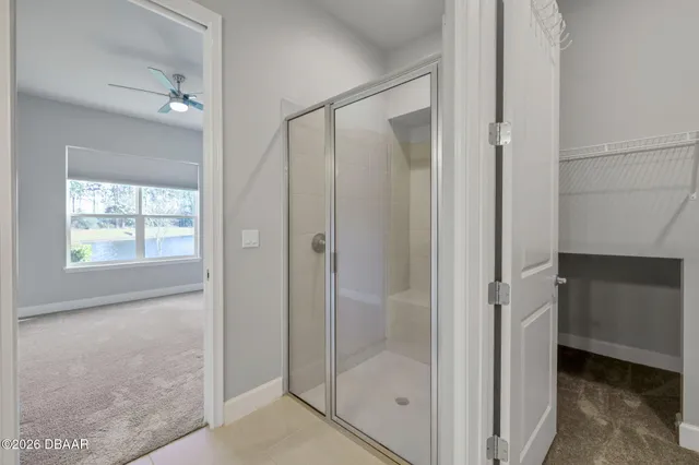 a bathroom with a shower and a sink