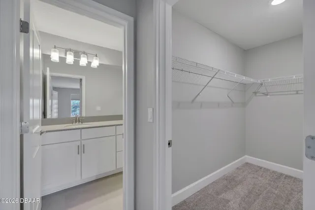 a bathroom with a light fixture and a mirror