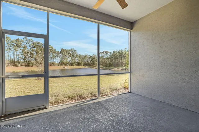front view of a brick house with a large window