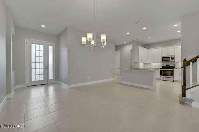 a view of a kitchen with a sink and cabinets