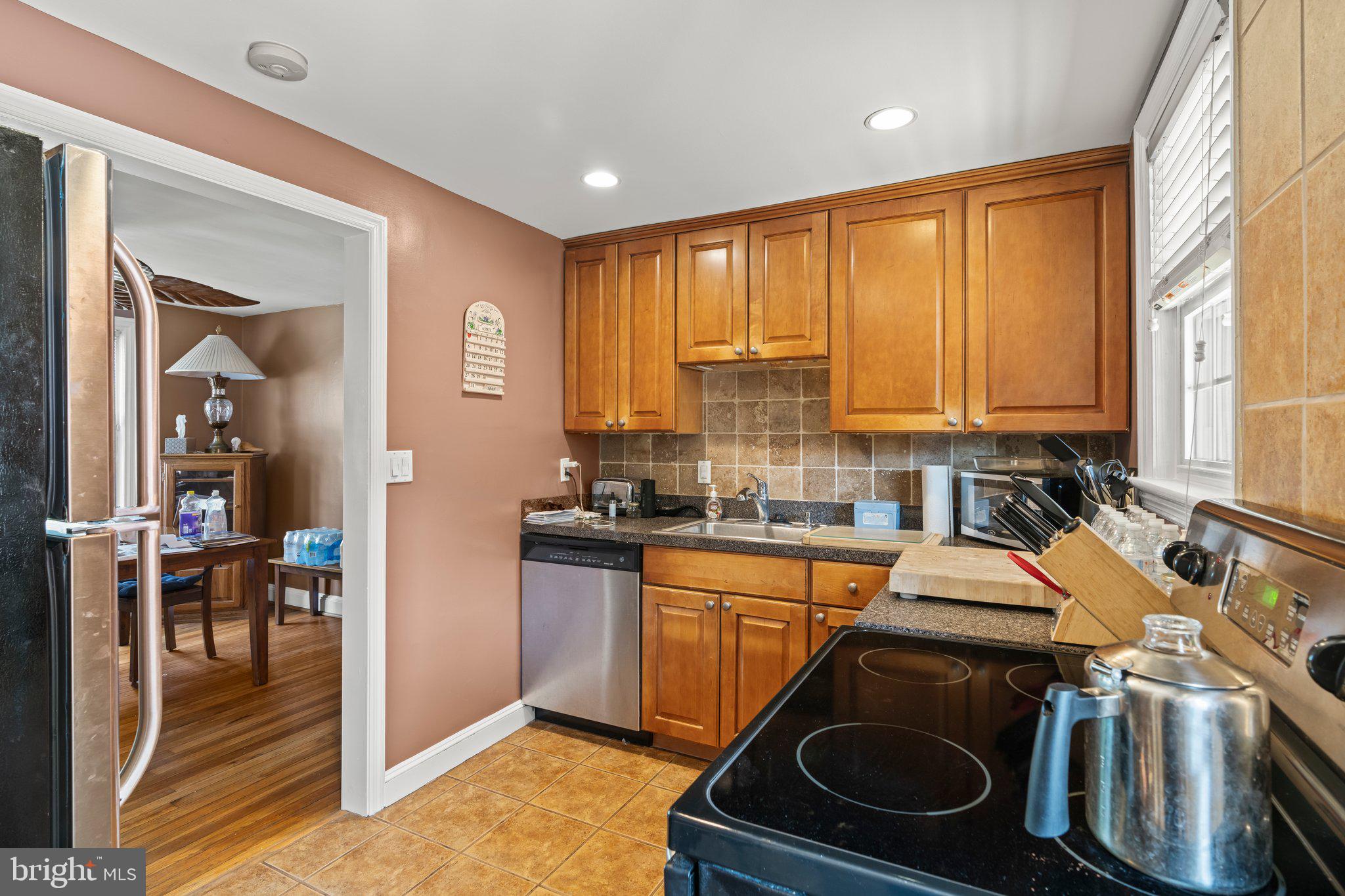 827 Dover Road Wynnewood, PA 19096 - Photo 11 of 23 a view of a kitchen with a sink a washer and dryer