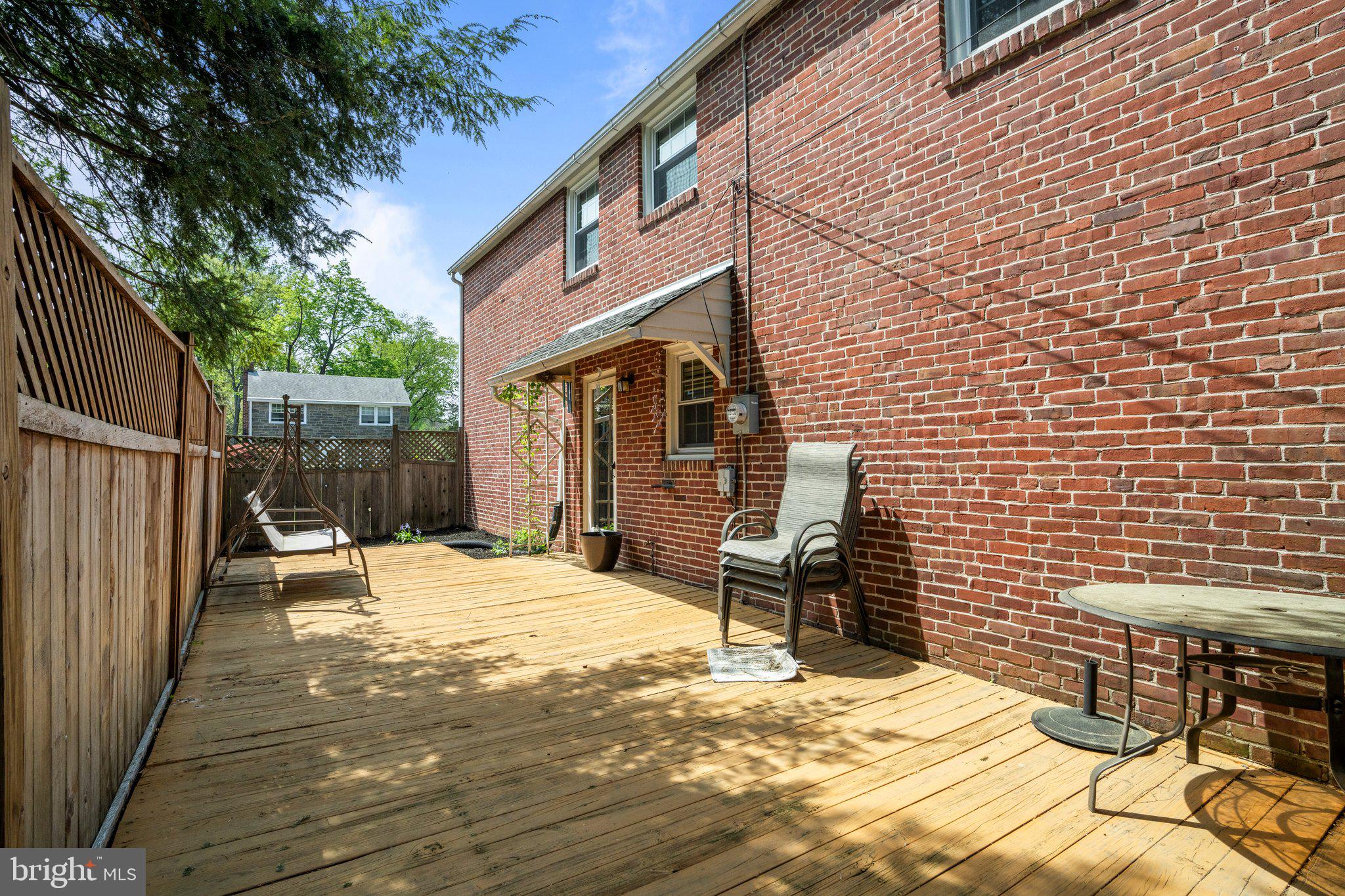 827 Dover Road Wynnewood, PA 19096 - Photo 21 of 23 a backyard of a house with table and chairs