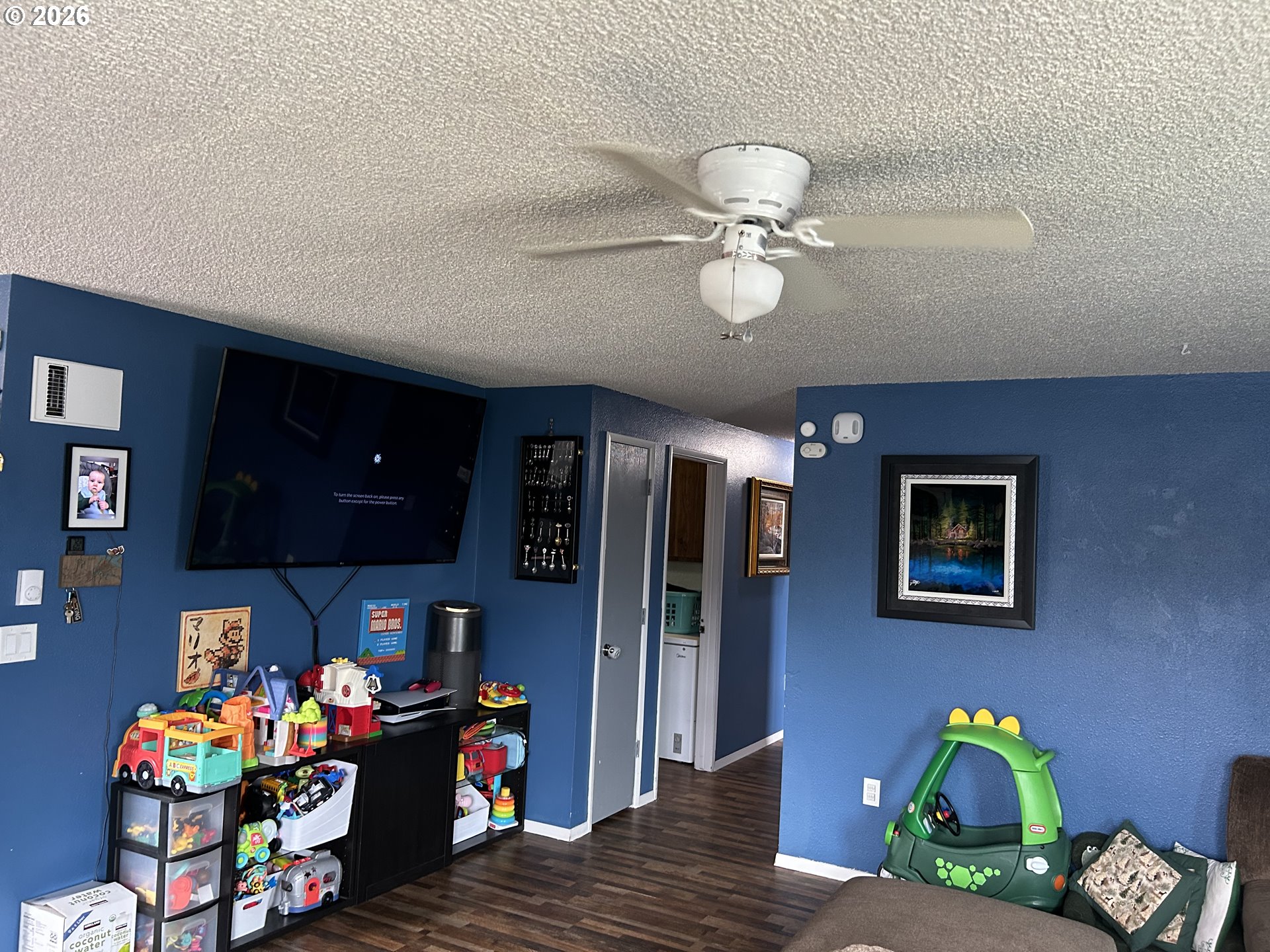 938 North 8th Street Reedsport, OR 97467 - Photo 6 of 16 a bedroom with a bed and a chandelier