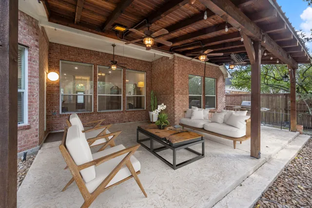 a outdoor living space with patio furniture and a potted plant