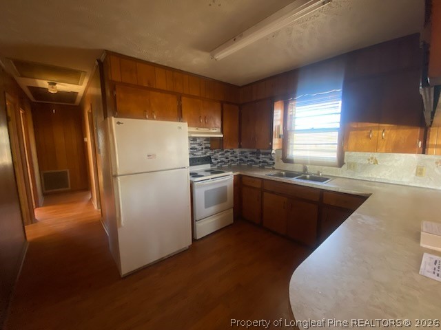2771 Bailey Road Fairmont, NC 28340 - Photo 4 of 10 a kitchen with a refrigerator sink and cabinets