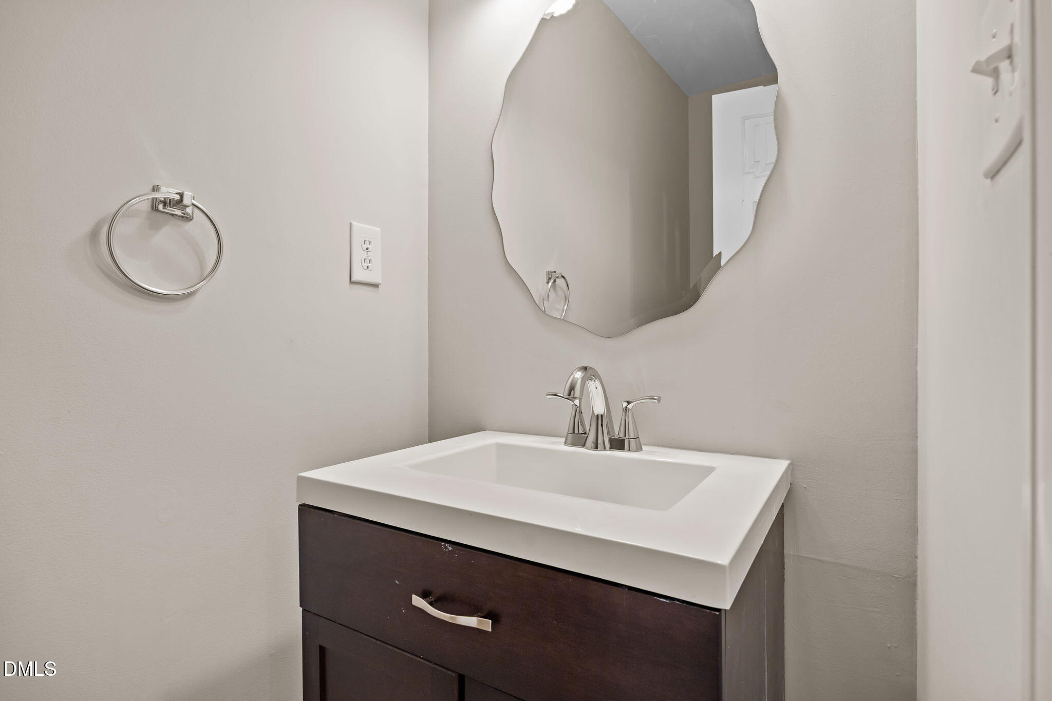 729 Wimberly Road Apex, NC 27523 - Photo 11 of 61 a bathroom with a sink and a mirror