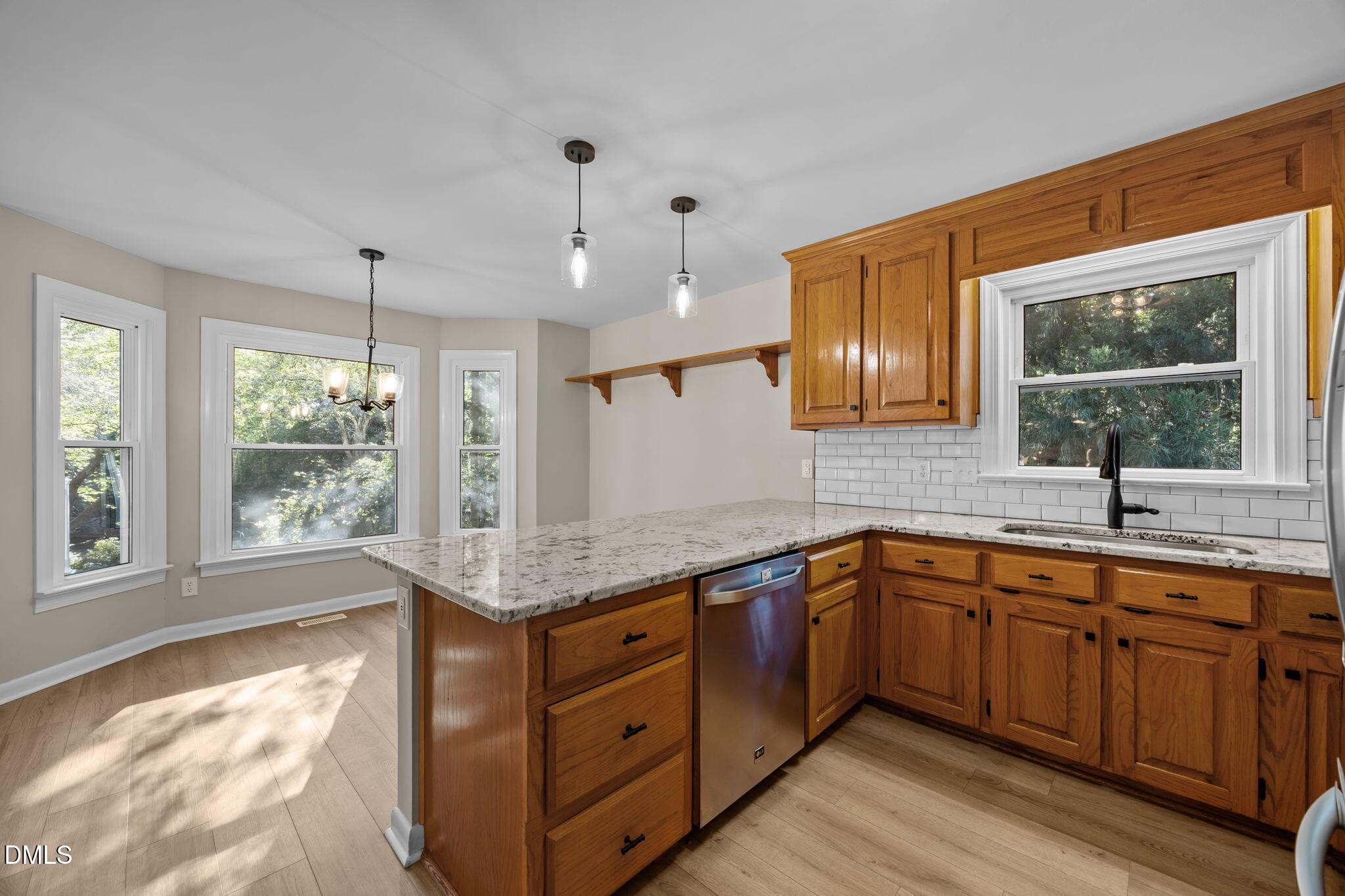729 Wimberly Road Apex, NC 27523 - Photo 14 of 61 a kitchen with a sink stove and window
