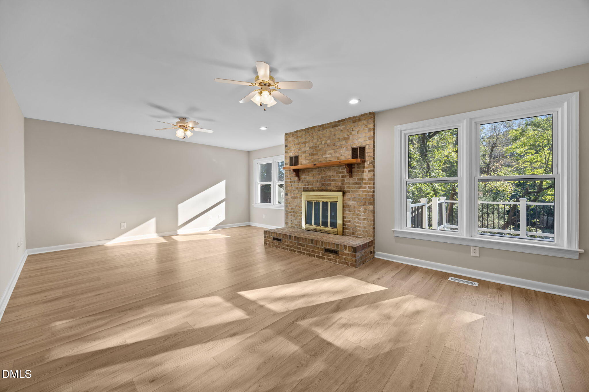 729 Wimberly Road Apex, NC 27523 - Photo 20 of 61 a view of an empty room with a window and fireplace