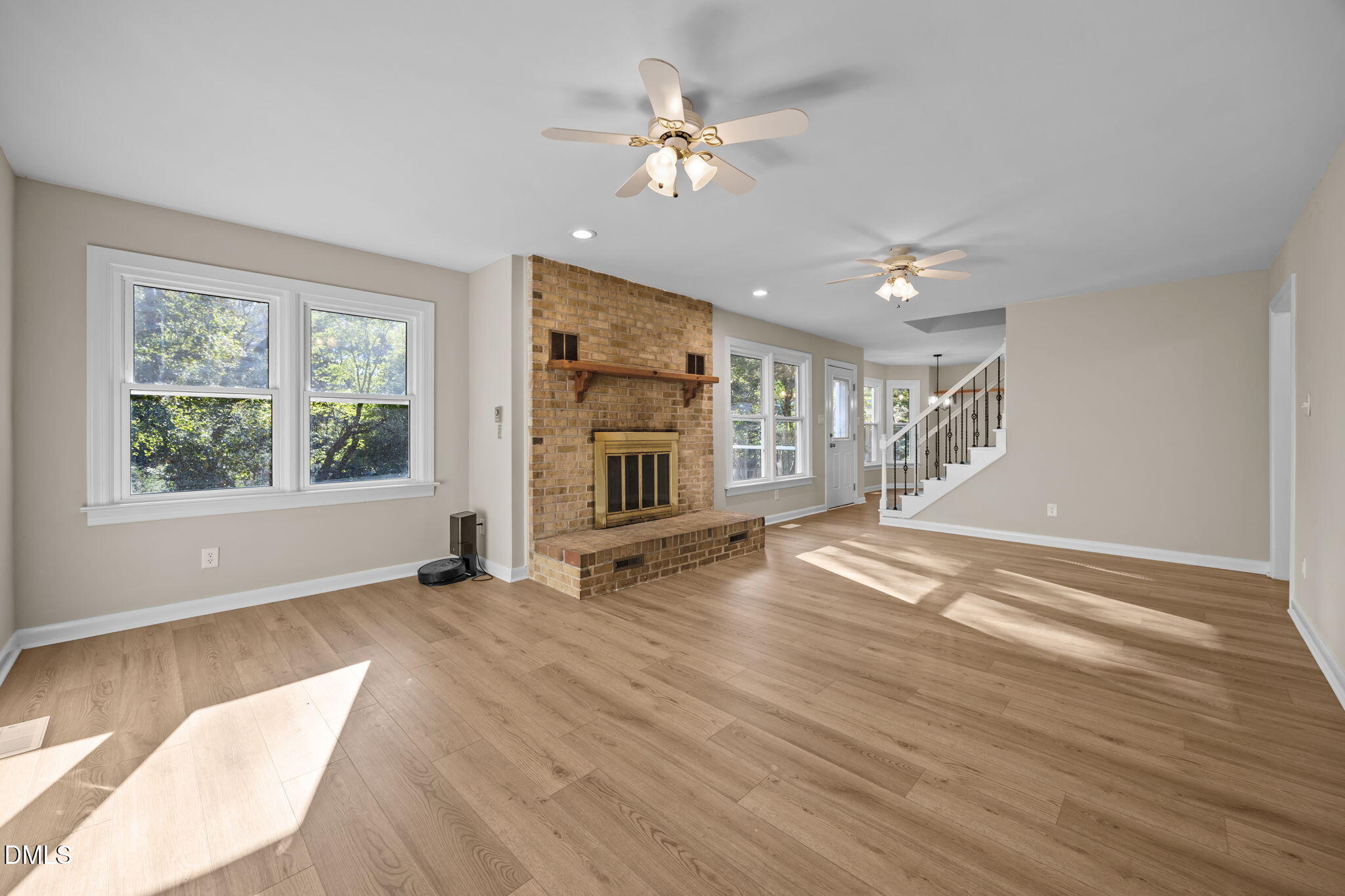 729 Wimberly Road Apex, NC 27523 - Photo 22 of 61 a view of an empty room with a window and wooden floor