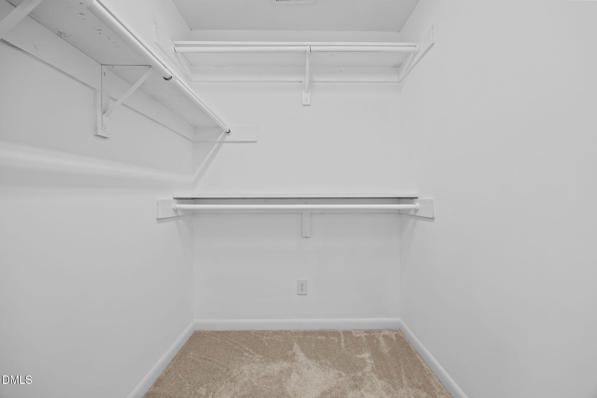 729 Wimberly Road Apex, NC 27523 - Photo 25 of 61 a view of a room with racks on the wall