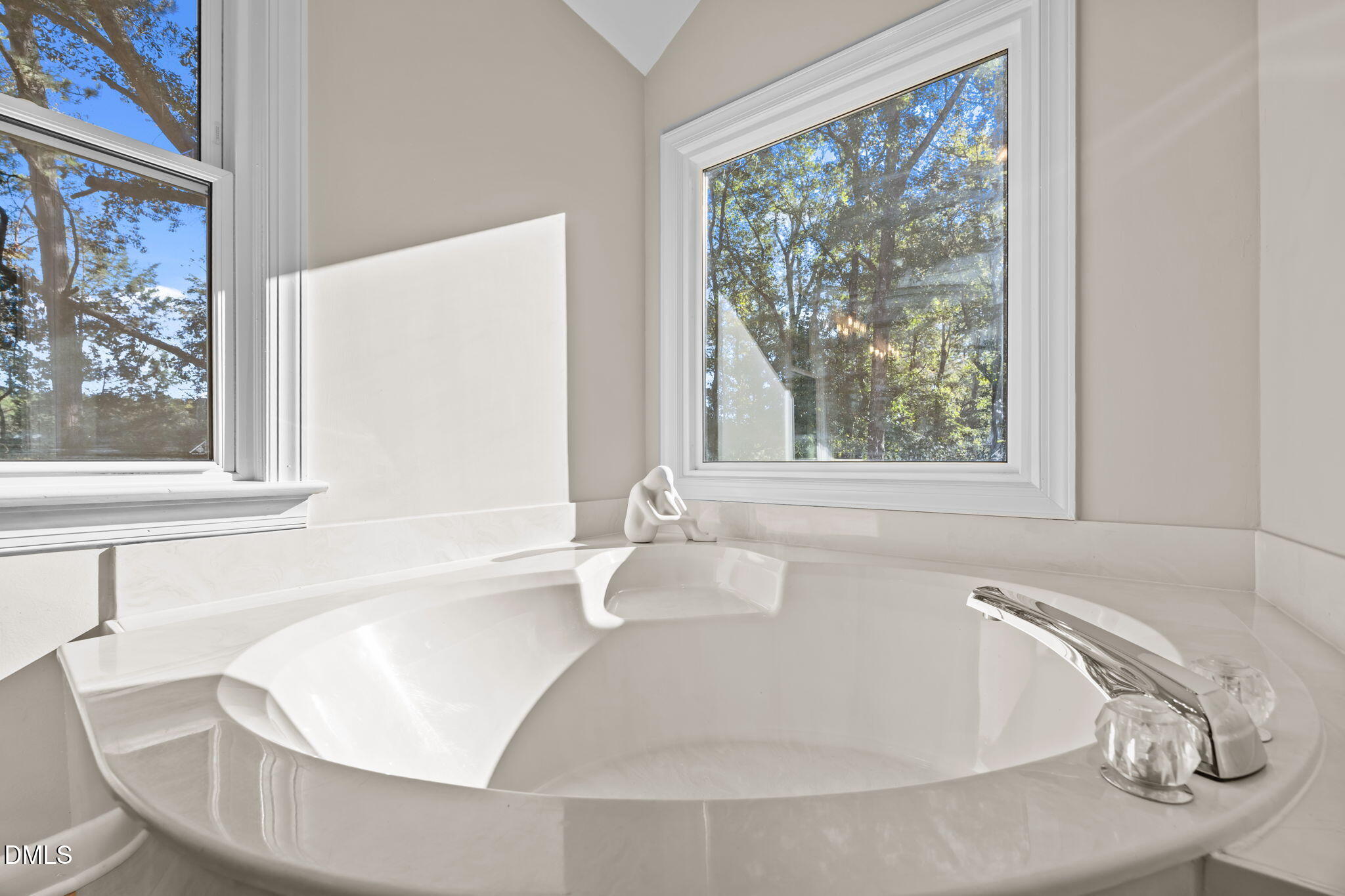 729 Wimberly Road Apex, NC 27523 - Photo 27 of 61 a white bath tub sitting in a bathroom next to a window