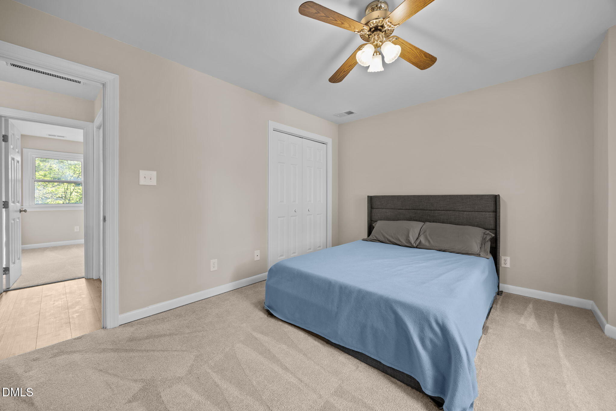 729 Wimberly Road Apex, NC 27523 - Photo 31 of 61 a bedroom with a bed and a chandelier