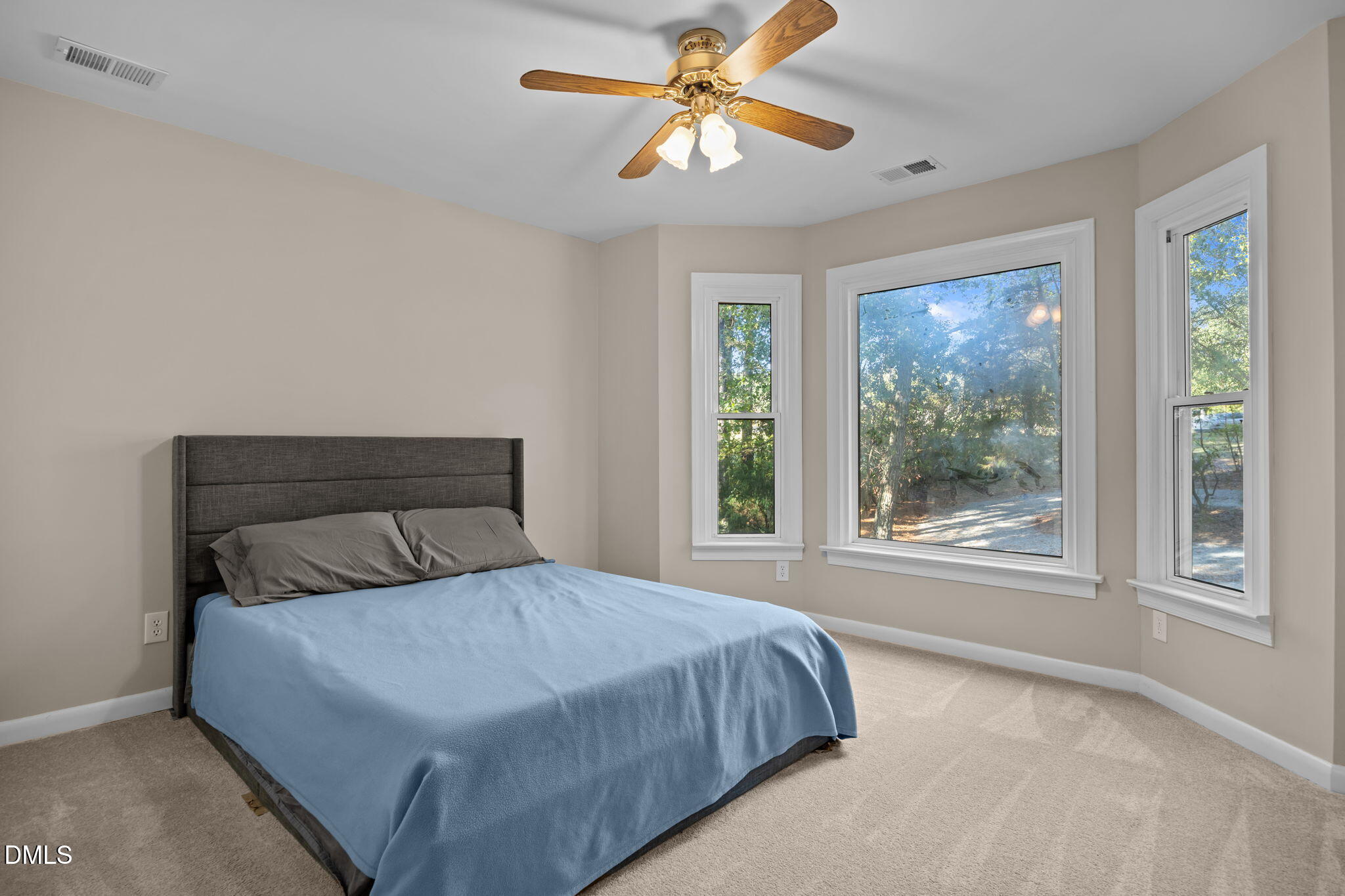 729 Wimberly Road Apex, NC 27523 - Photo 32 of 61 a bedroom with a large bed and a window