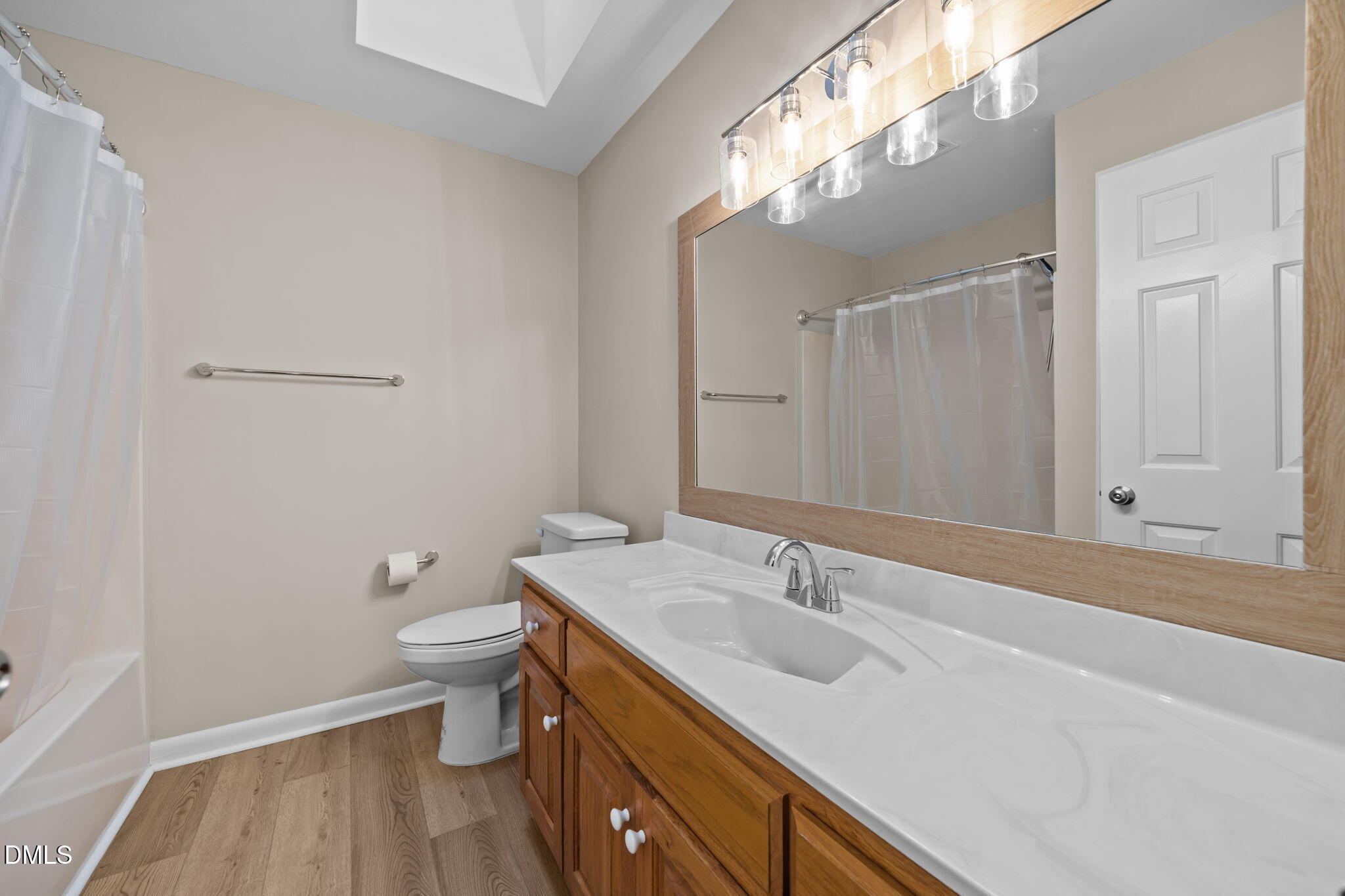 729 Wimberly Road Apex, NC 27523 - Photo 34 of 61 a bathroom with a sink and a mirror