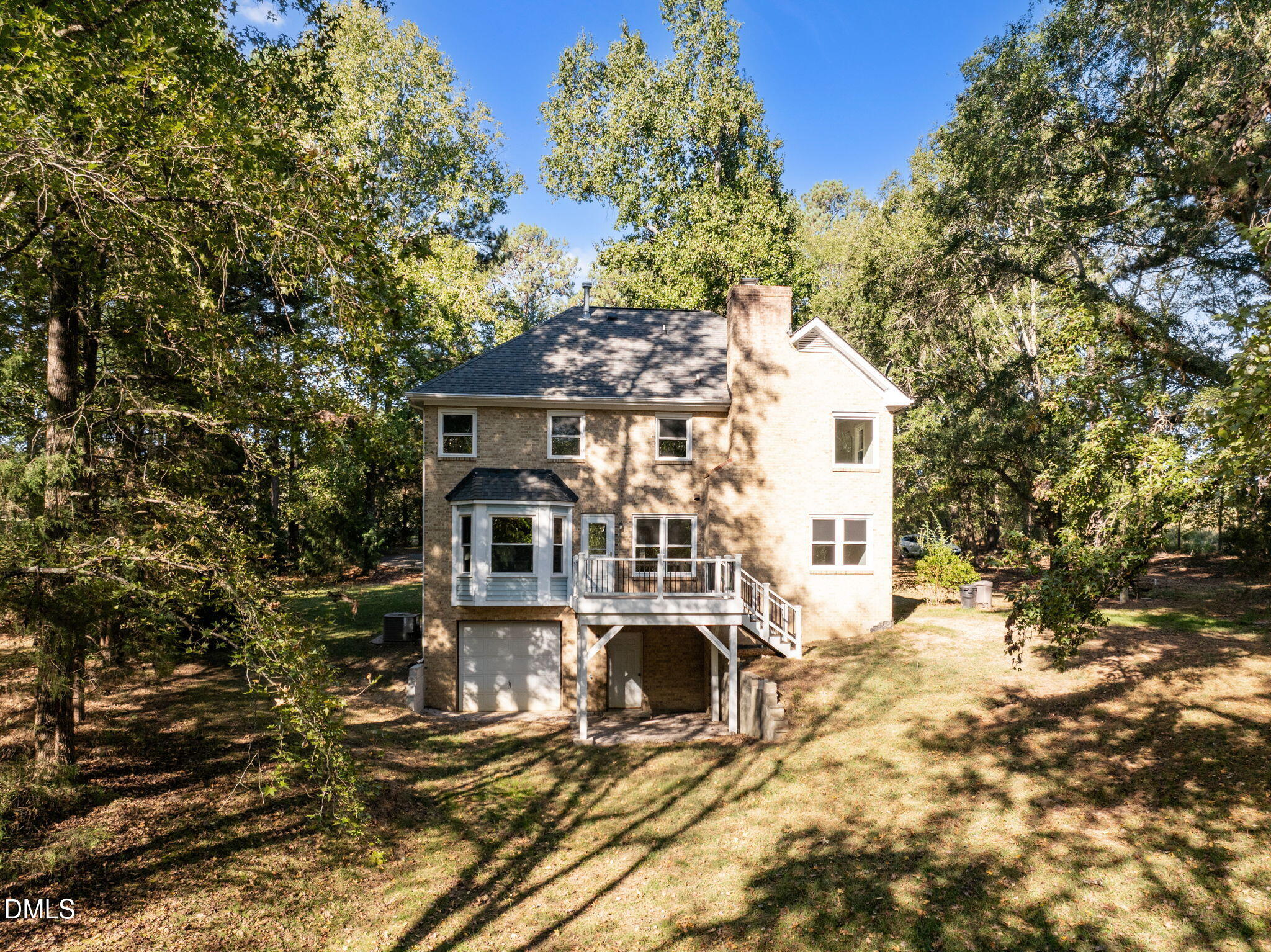 729 Wimberly Road Apex, NC 27523 - Photo 48 of 61 a view of a white house with a large tree