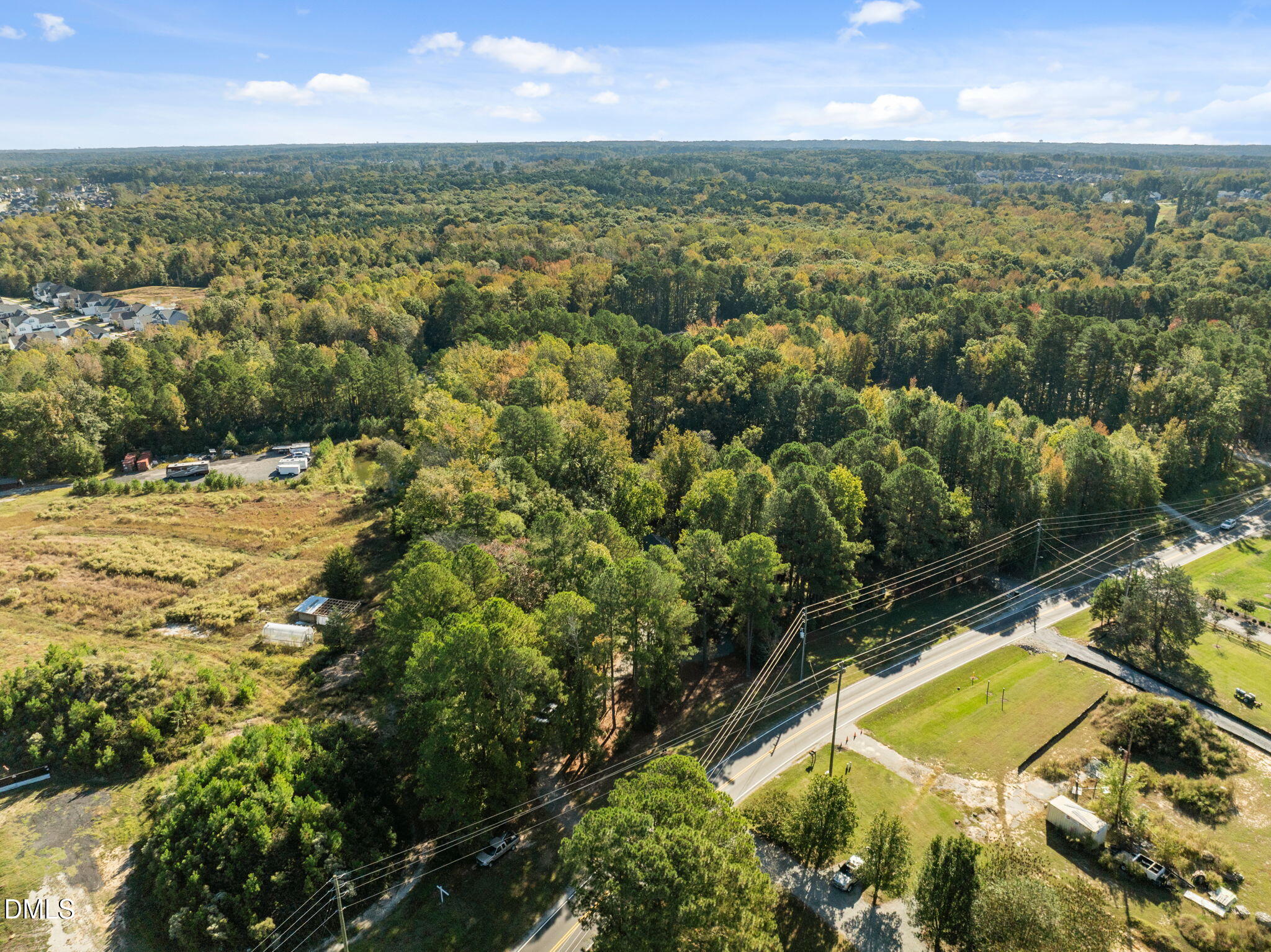 729 Wimberly Road Apex, NC 27523 - Photo 57 of 61 an aerial view of residential houses with outdoor space and swimming pool