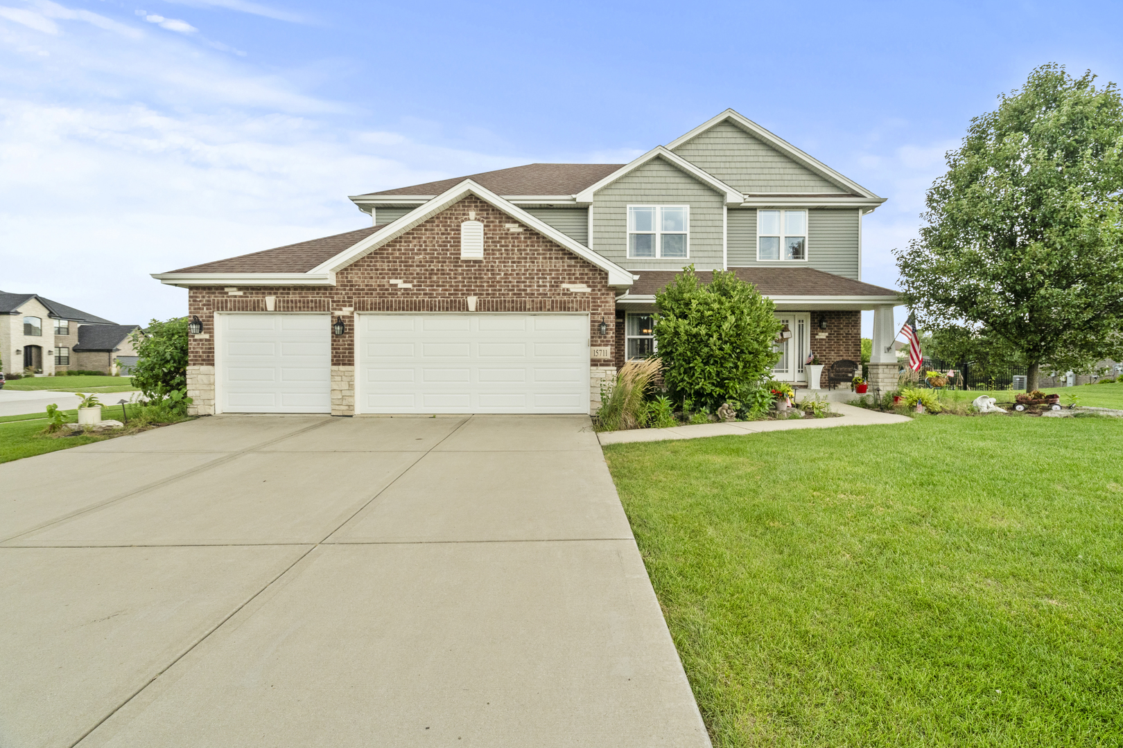15711 Mueller Way Lockport, IL 60441 - Photo 1 of 37 a front view of a house with a yard