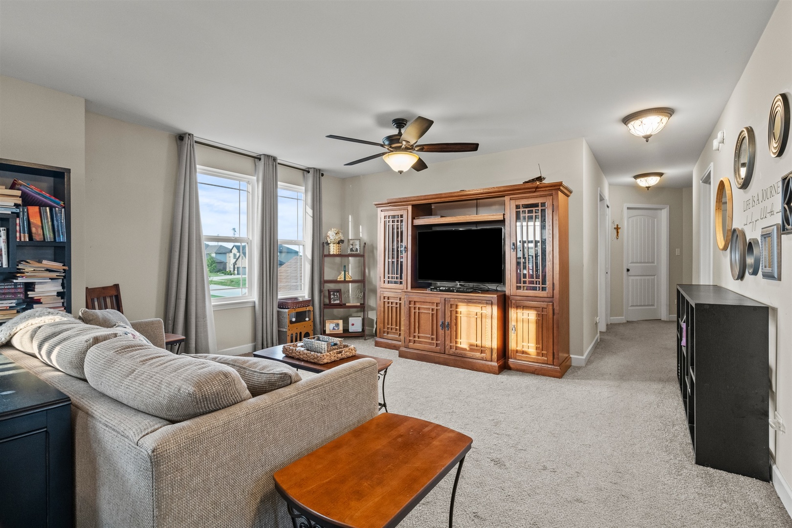 15711 Mueller Way Lockport, IL 60441 - Photo 16 of 37 a living room with furniture and a flat screen tv