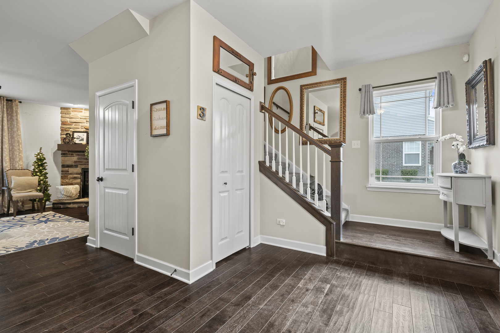 15711 Mueller Way Lockport, IL 60441 - Photo 2 of 37 a view of a livingroom with wooden floor and stairs