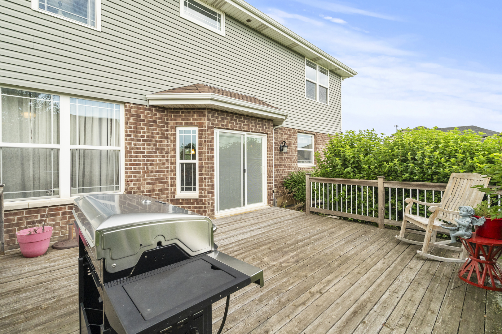 15711 Mueller Way Lockport, IL 60441 - Photo 23 of 37 a view of a patio with a table and chairs next to a window
