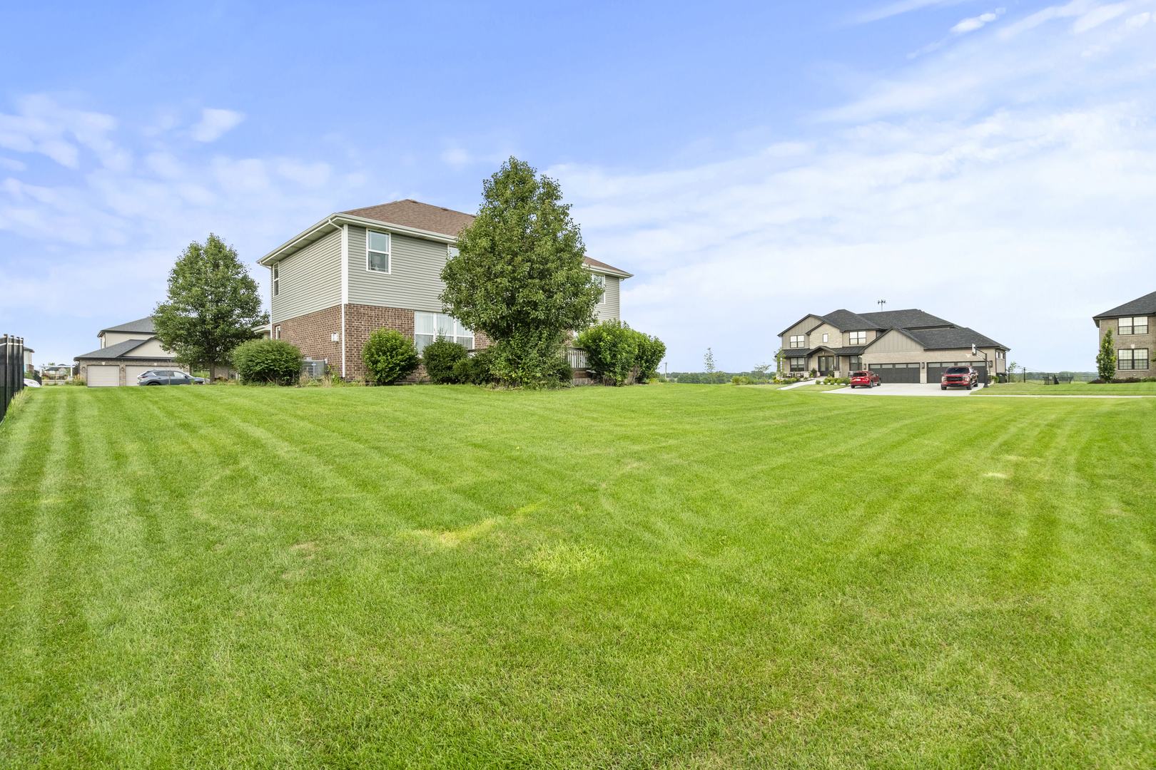 15711 Mueller Way Lockport, IL 60441 - Photo 27 of 37 a view of a house with a yard and garage