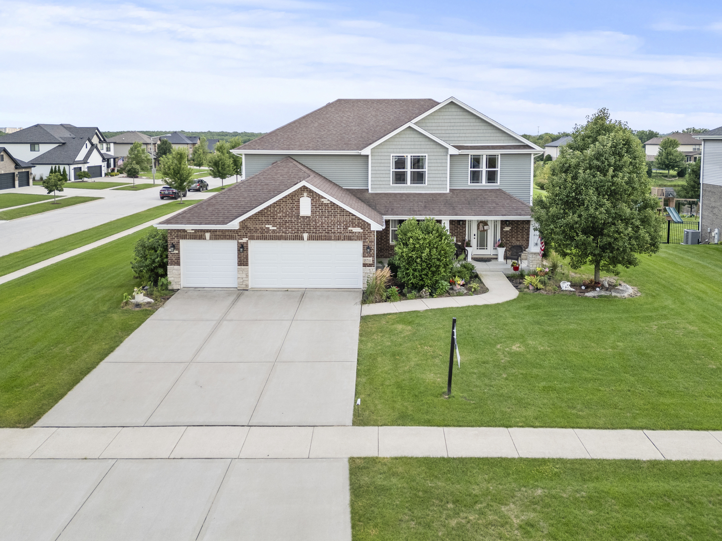 15711 Mueller Way Lockport, IL 60441 - Photo 30 of 37 a front view of a house with a yard