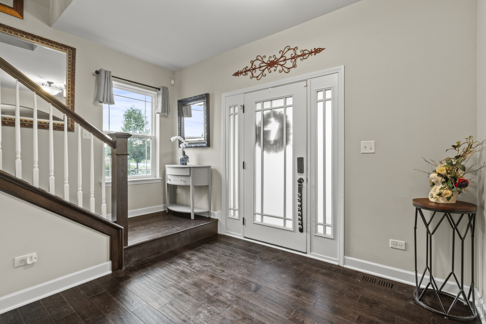 15711 Mueller Way Lockport, IL 60441 - Photo 3 of 37 a view of a hallway with wooden floor and staircase