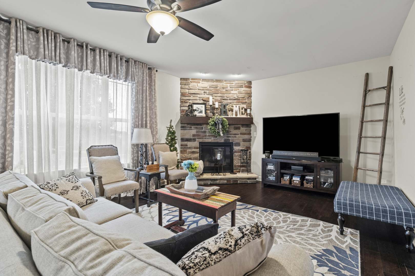 15711 Mueller Way Lockport, IL 60441 - Photo 5 of 37 a living room with furniture a flat screen tv and a large window