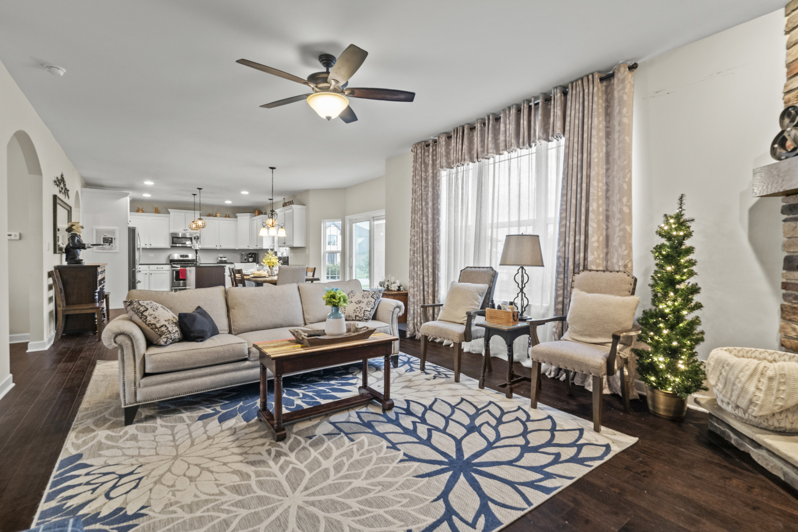 15711 Mueller Way Lockport, IL 60441 - Photo 6 of 37 a living room with furniture kitchen view and a large window