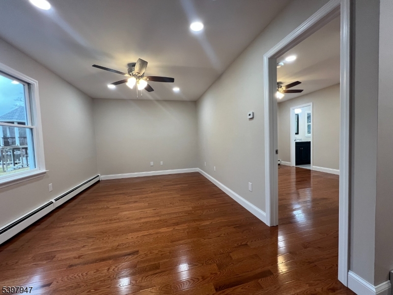 18 West River Styx Road, Unit 3 Hopatcong, NJ 07843 - Photo 6 of 9 a view of empty room with wooden floor