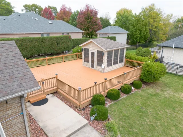 a view of a house with backyard porch and sitting area
