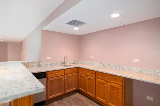 a kitchen with a sink and a stove