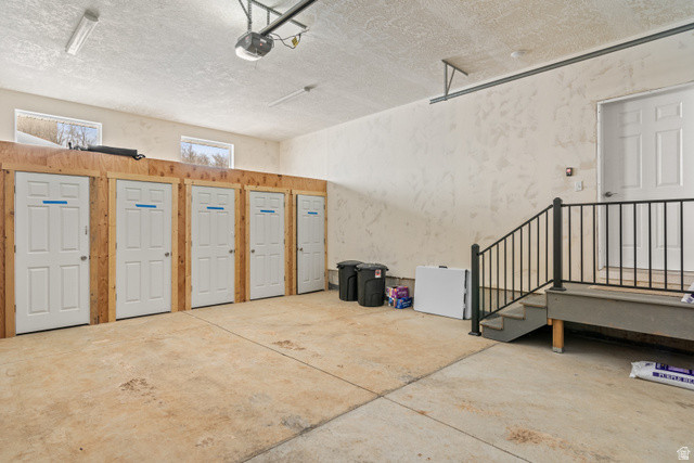 1343 North Trapper Loop Garden City, UT 84028 - Photo 24 of 56 Garage featuring a garage door opener