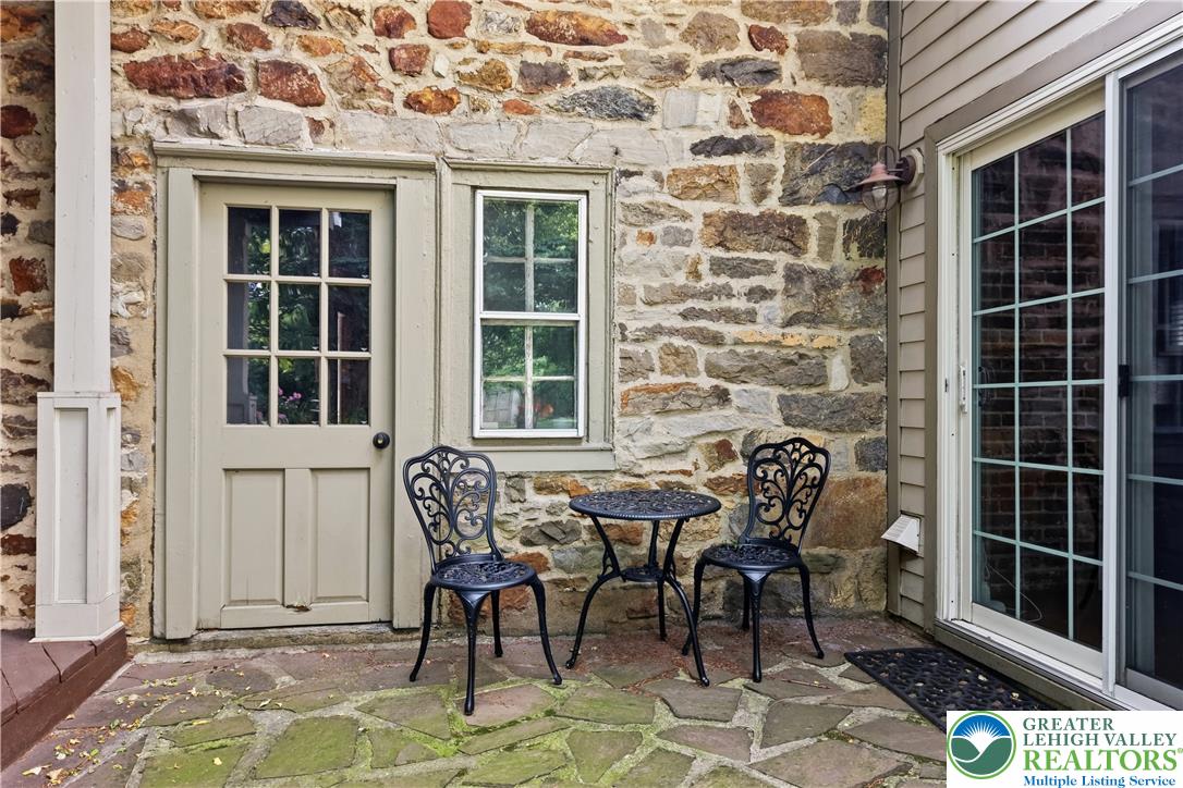 2014 Linden Street Bethlehem, PA 18017 - Photo 66 of 85 A quaint patio area, framed by rustic stone construction and a classic paneled door.