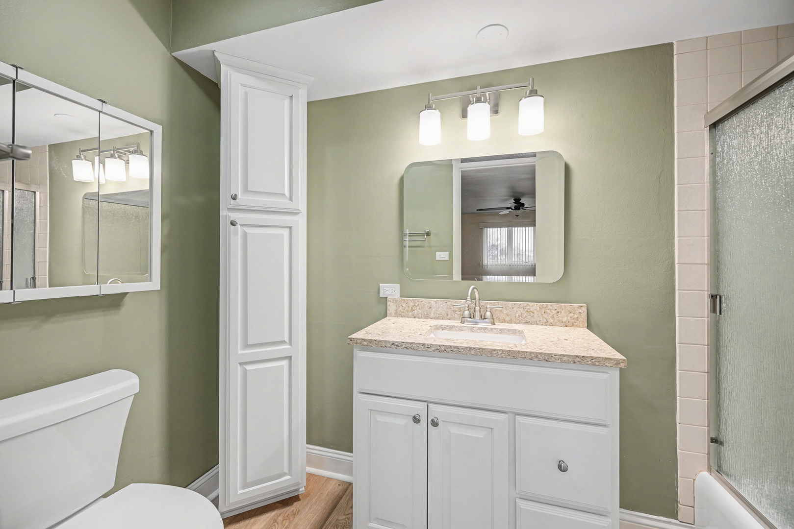 40 South Main Street, Unit 4A Glen Ellyn, IL 60137 - Photo 14 of 25 a bathroom with a toilet sink and mirror