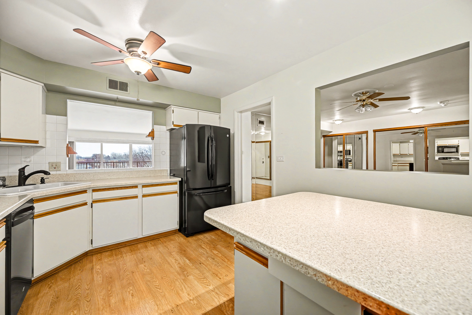 40 South Main Street, Unit 4A Glen Ellyn, IL 60137 - Photo 6 of 25 a kitchen with stainless steel appliances granite countertop a sink a stove and refrigerator