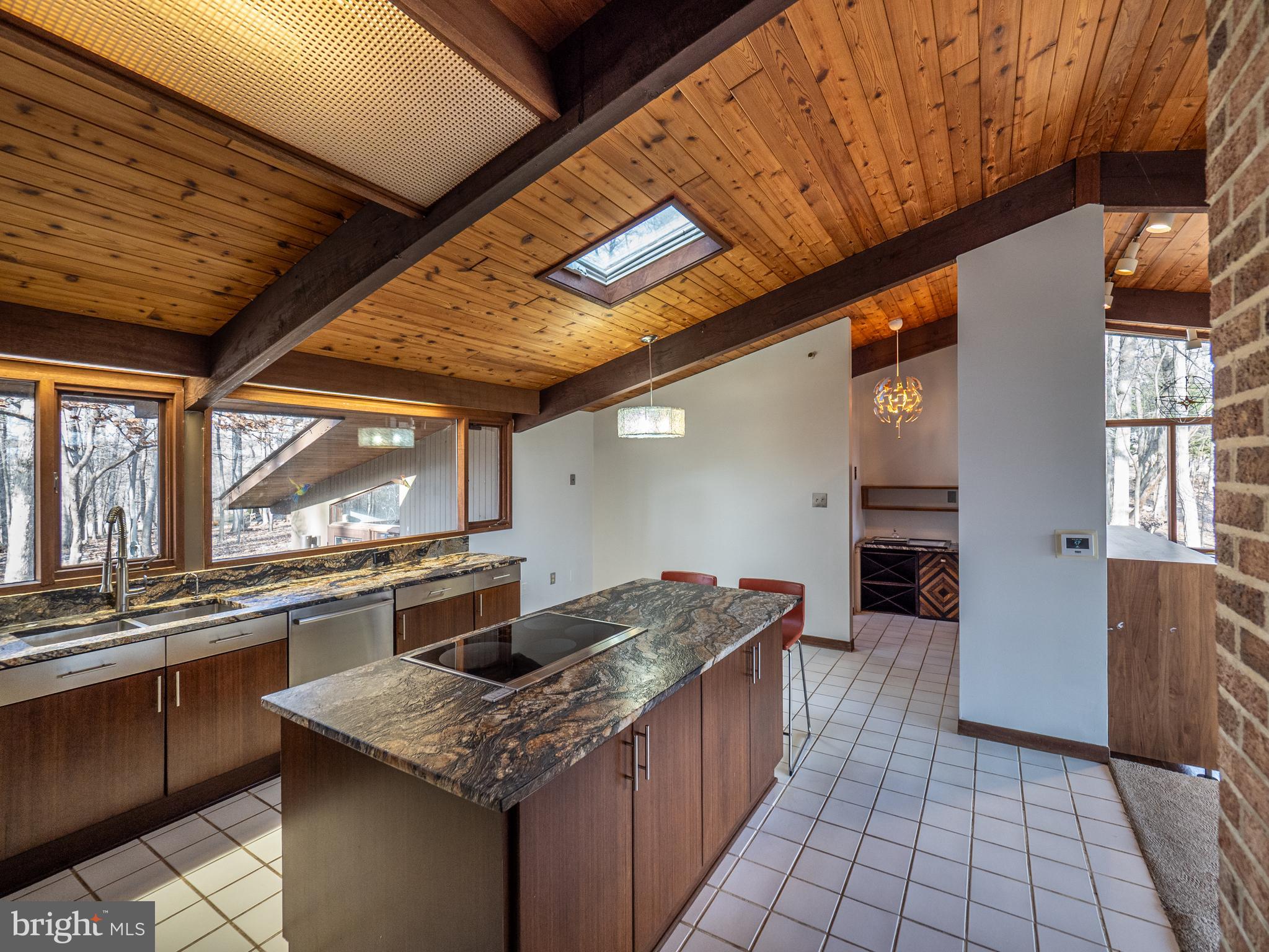 14805 Mockingbird Drive Darnestown, MD 20874 - Photo 12 of 35 a kitchen with stainless steel appliances granite countertop a sink stove and cabinets