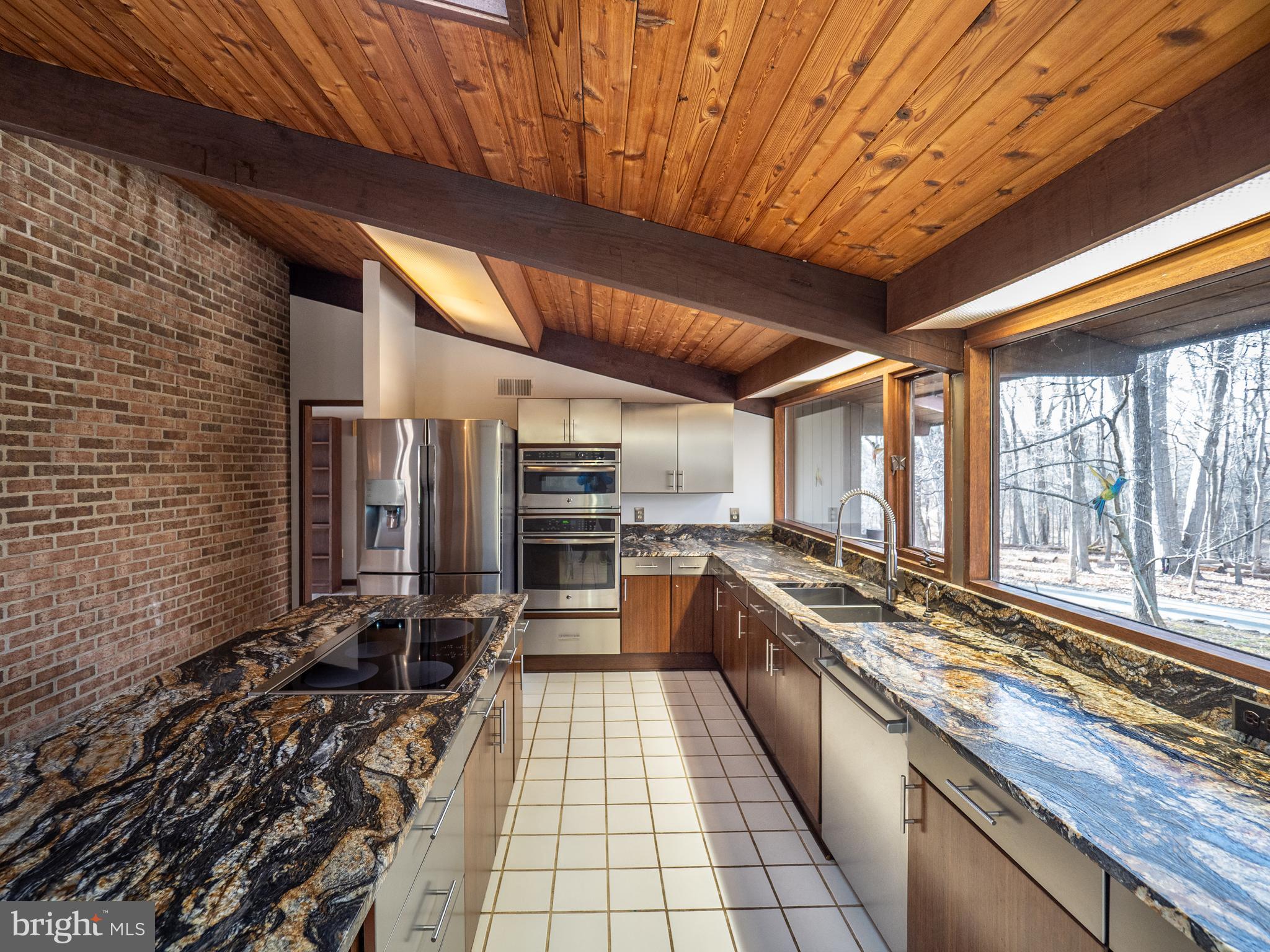 14805 Mockingbird Drive Darnestown, MD 20874 - Photo 13 of 35 a large kitchen with lots of counter space and windows