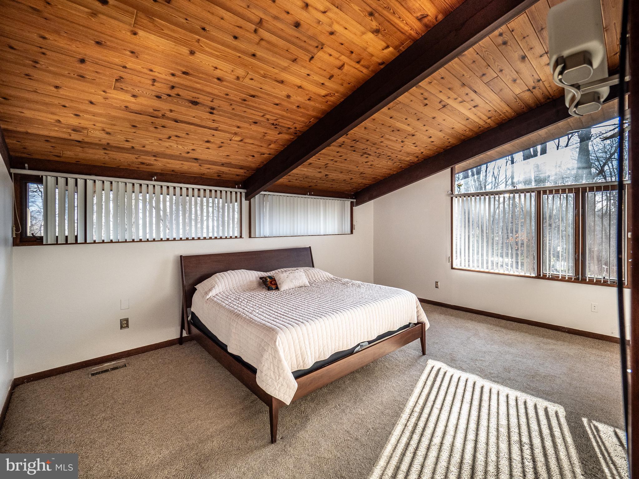14805 Mockingbird Drive Darnestown, MD 20874 - Photo 16 of 35 a spacious bedroom with a bed and a window