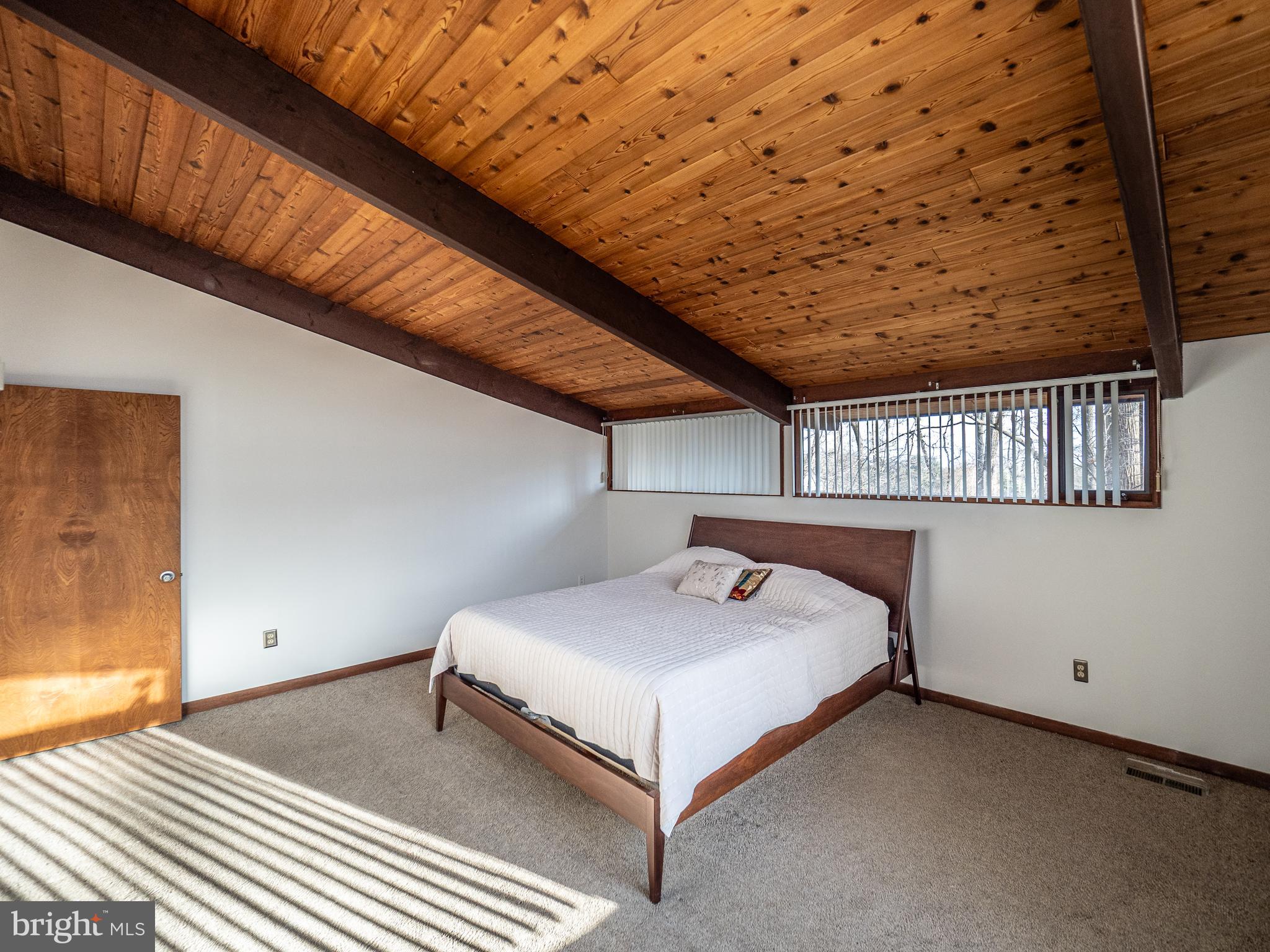 14805 Mockingbird Drive Darnestown, MD 20874 - Photo 17 of 35 a bedroom with a bed and a night stand